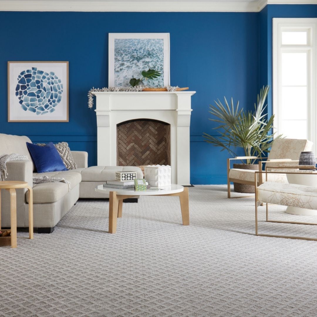 patterned beige carpet in blue living room